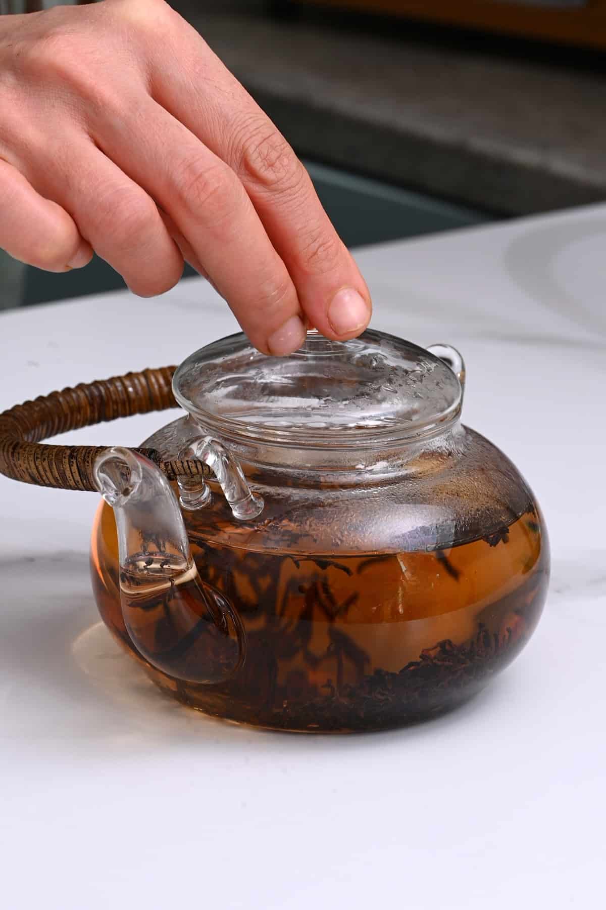 Steeping black tea in a pot