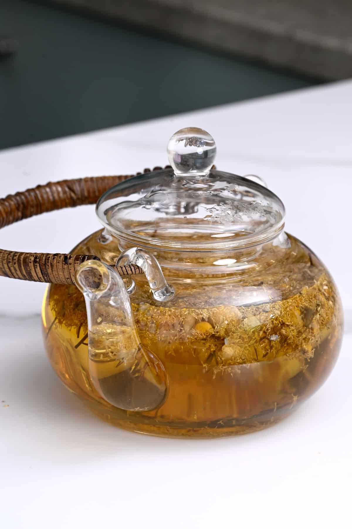 A teapot with chamomile tea