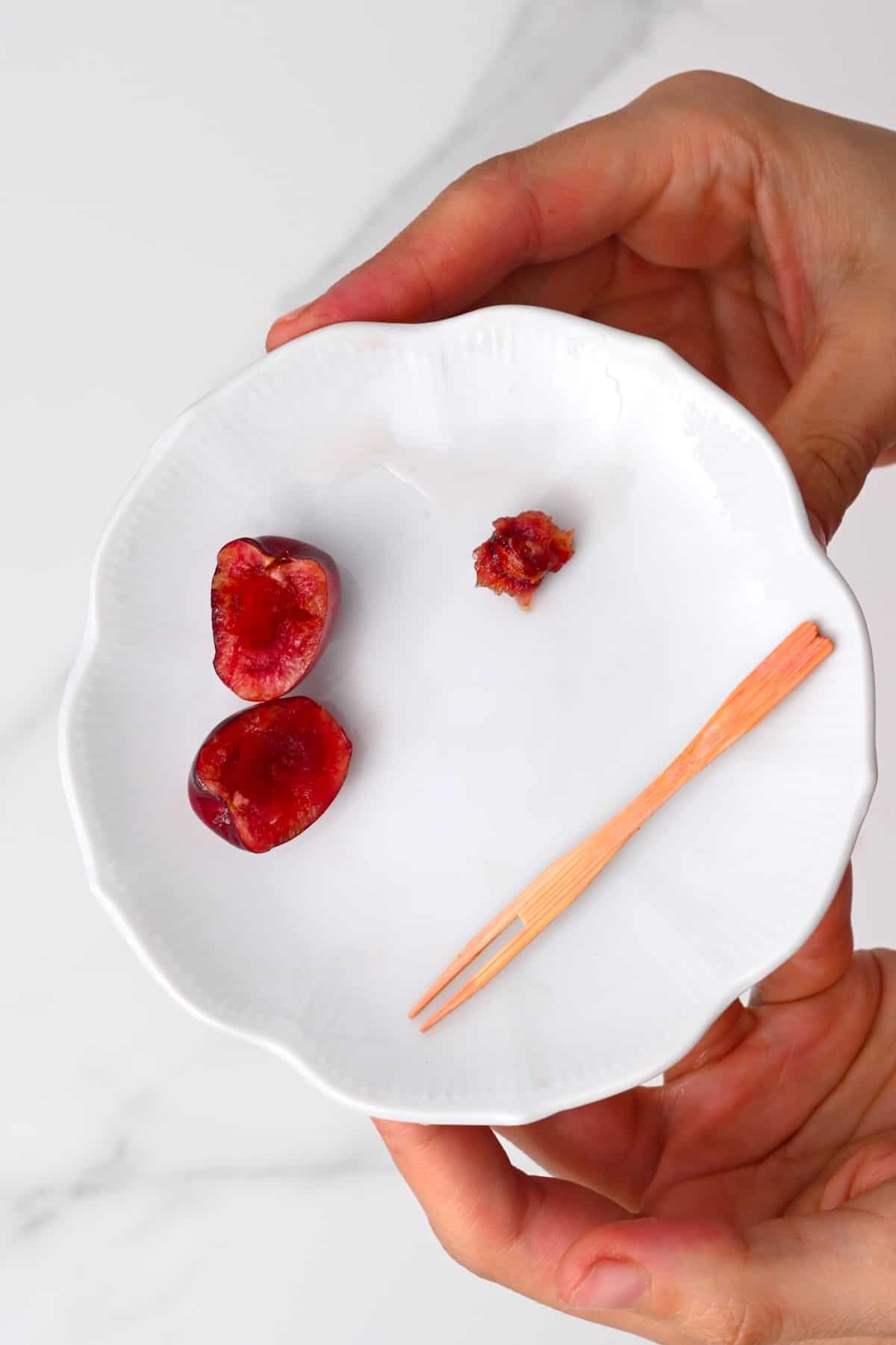 Cherry cut with a fork