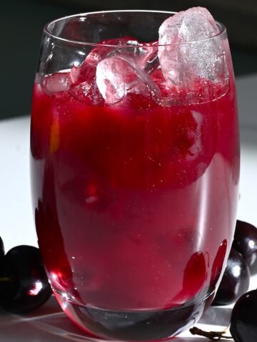 Cherry juice in a glass with ice