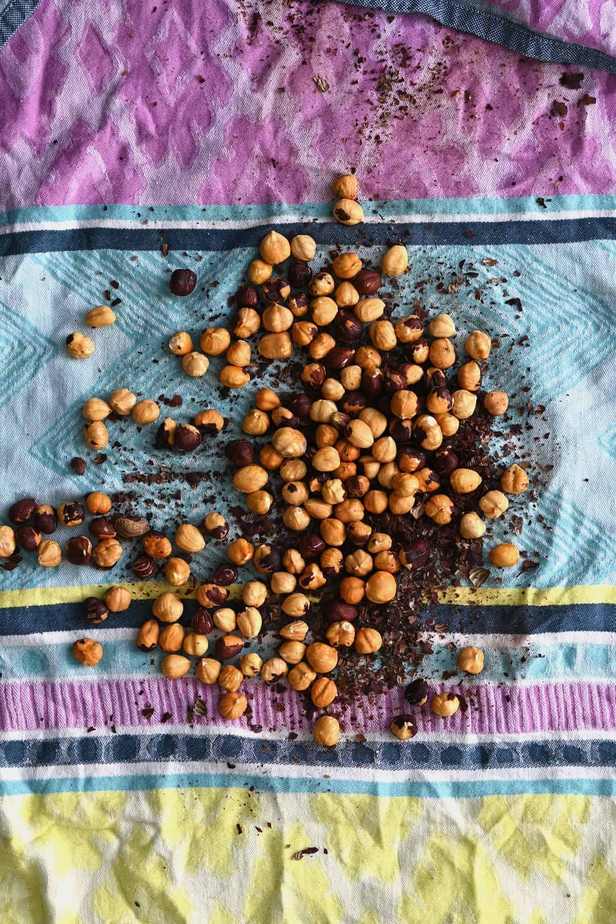 Hazelnuts on a kitchen towel with the skins removed