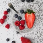 Chia pudding in a bowl topped with mixed berries - 16