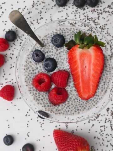 Chia pudding in a bowl topped with mixed berries