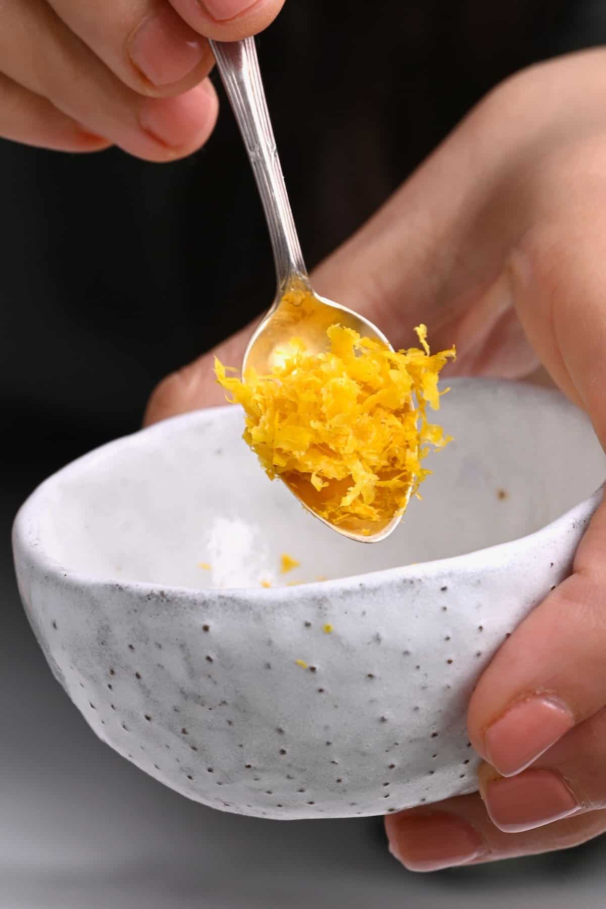 Close up of a spoonful with lemon zest