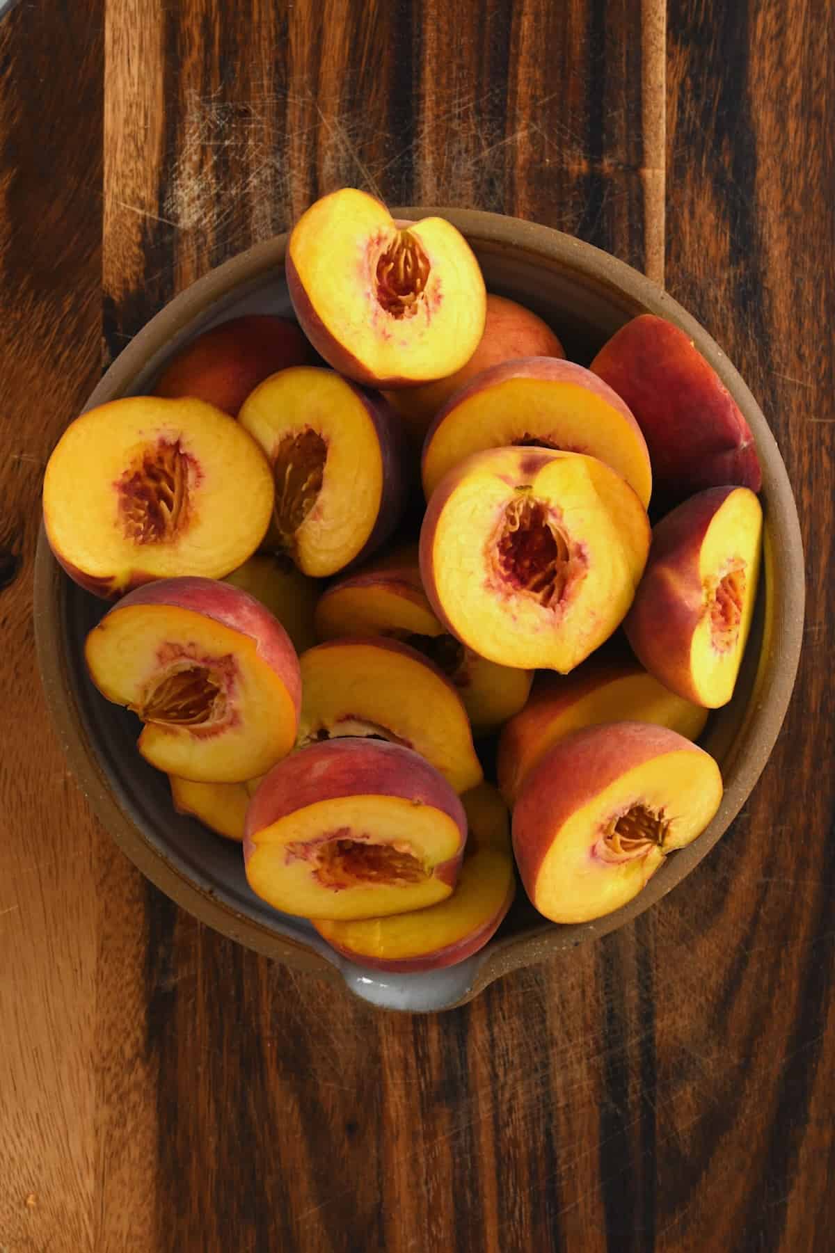 Halved peaches in a bowl