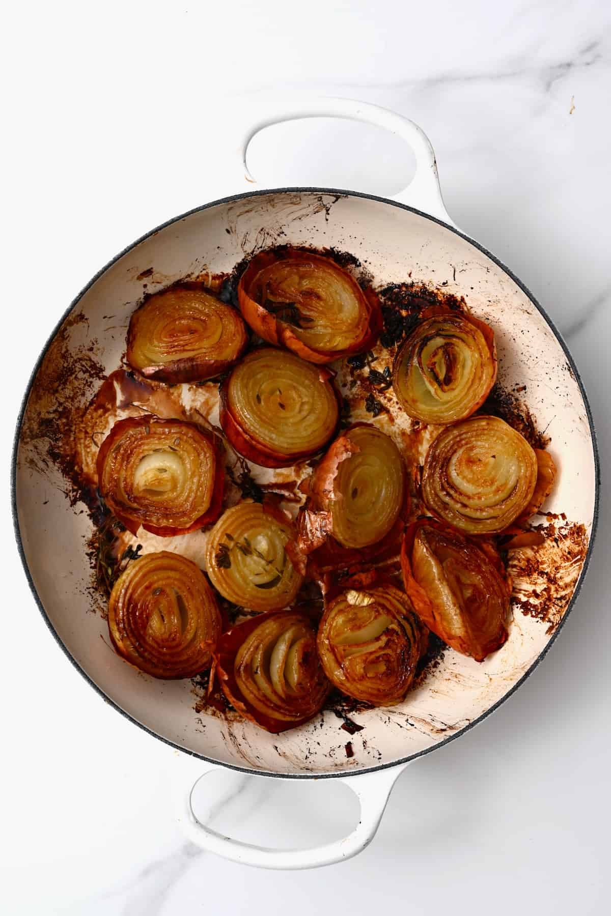 Freshly roasted onions in a pan