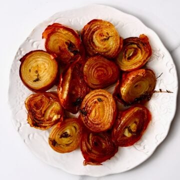 A plate with roasted onion halves