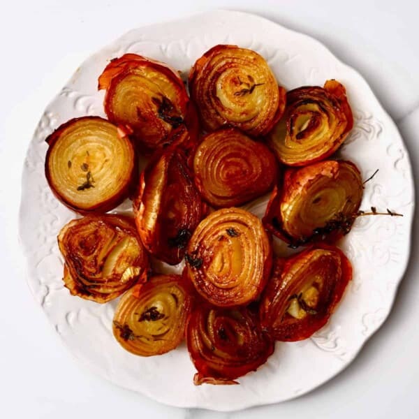 A plate with roasted onion halves