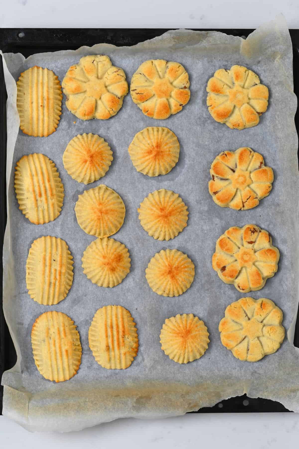 Freshly baked maamoul cookies on a baking tray