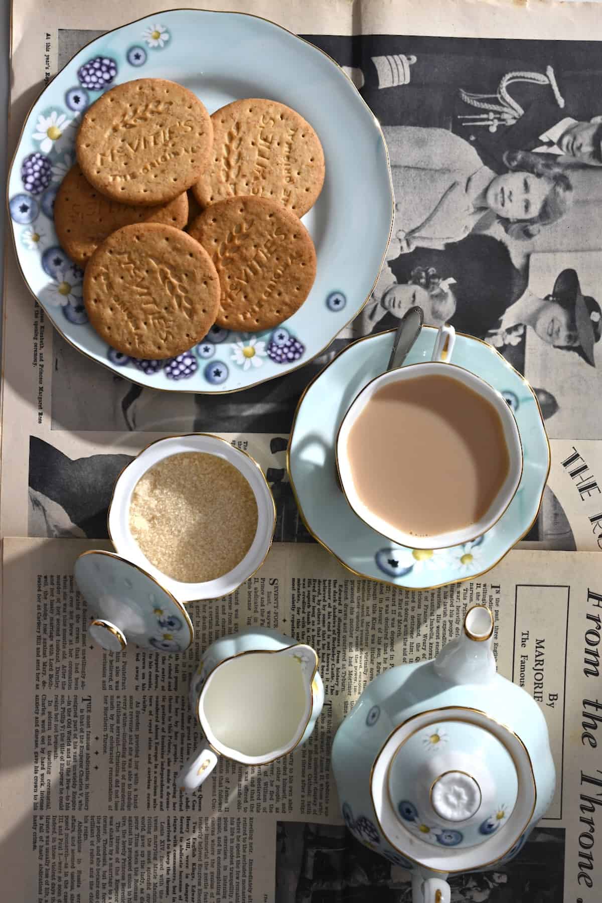 A set with milk tea sugar and biscuits