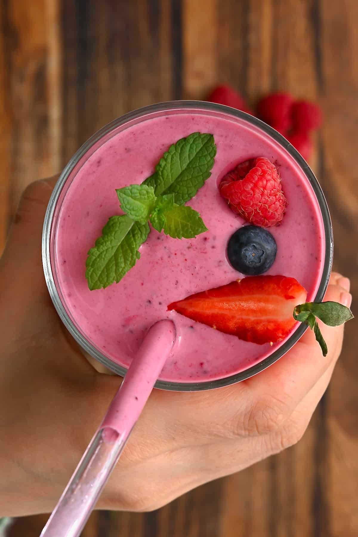 A glass with mixed berry smoothie