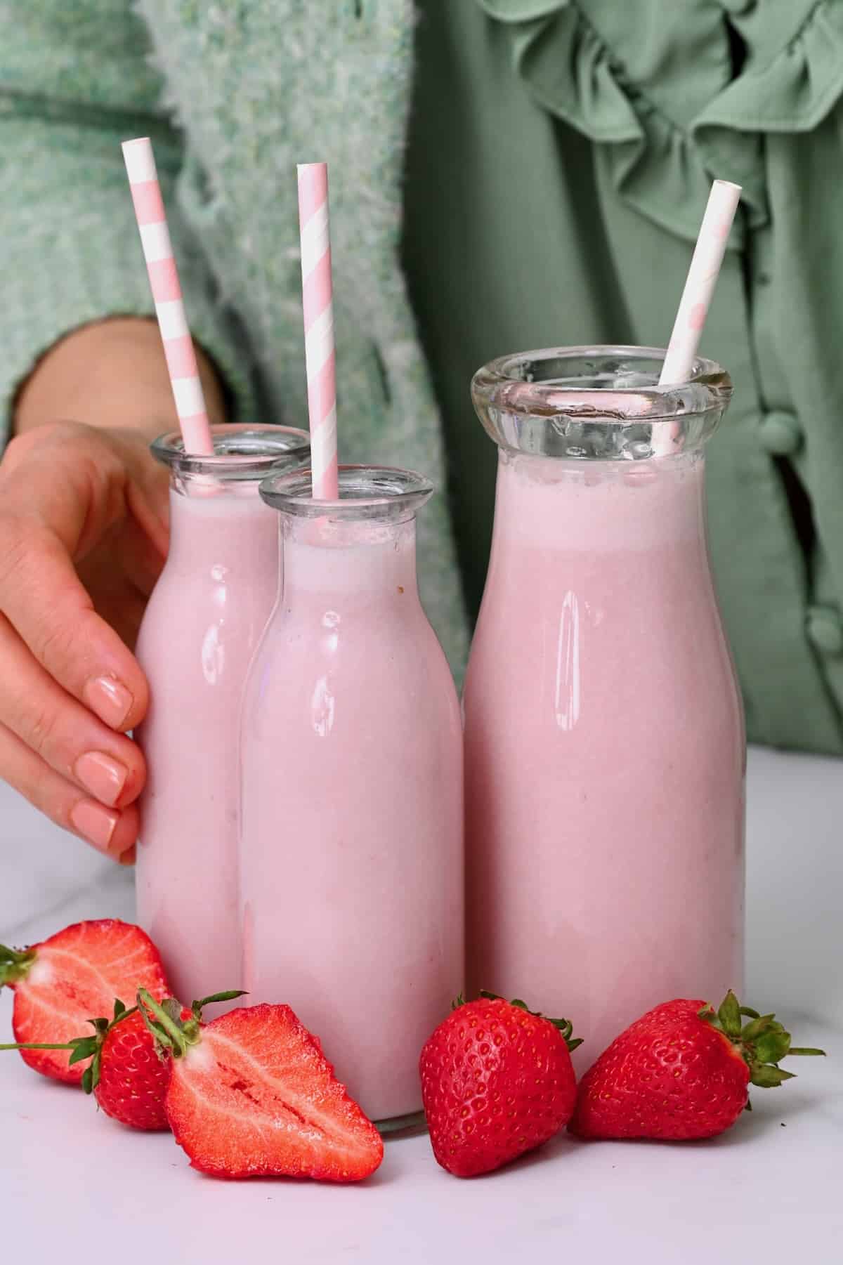 Three bottles with strawberry milk