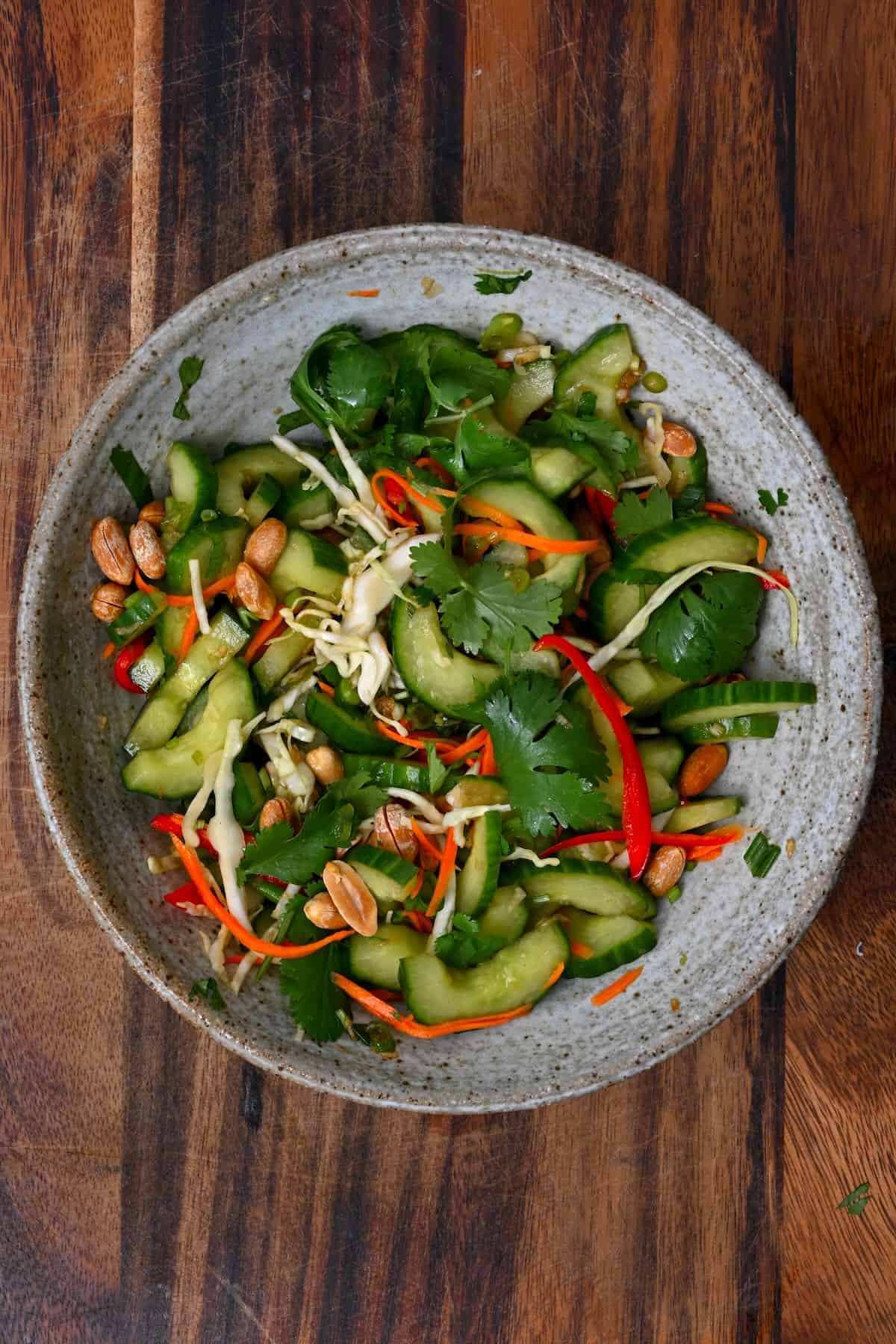 A big bowl with cucumber Thai salad