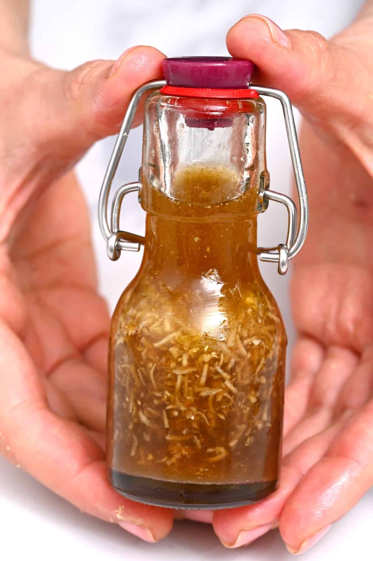 A little bottle with homemade Asian salad dressing