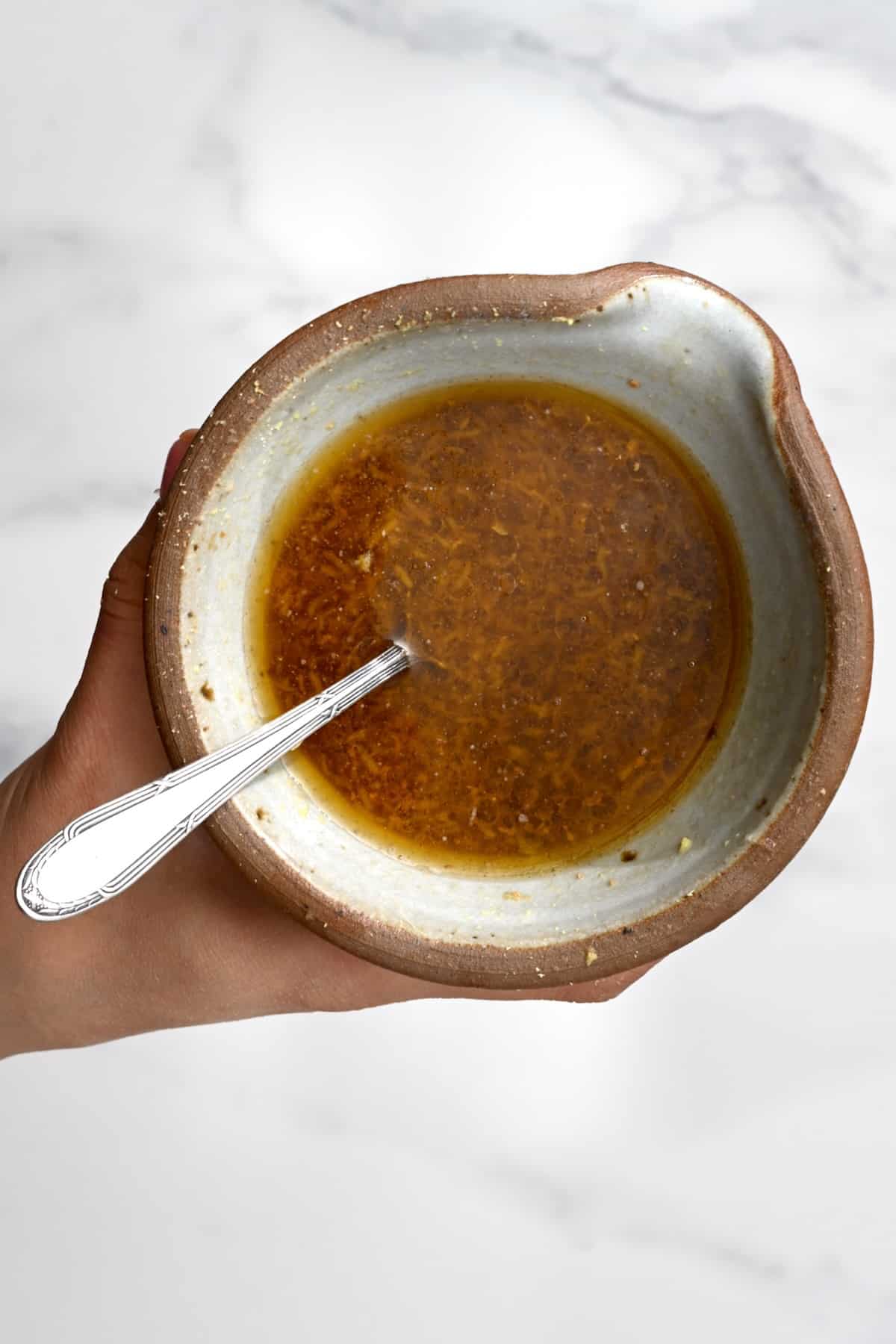 Mixing salad dressing in a bowl