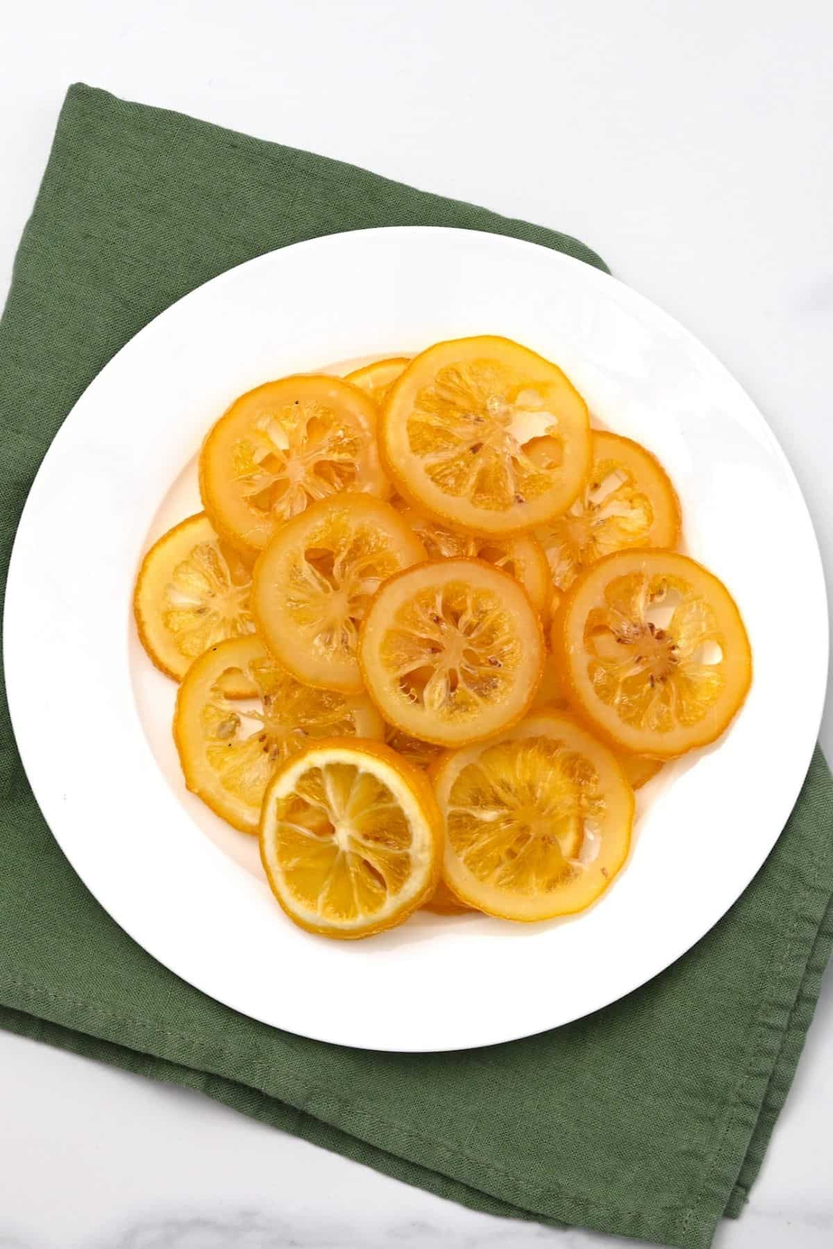 Homemade candied lemon slices arranged on a plate