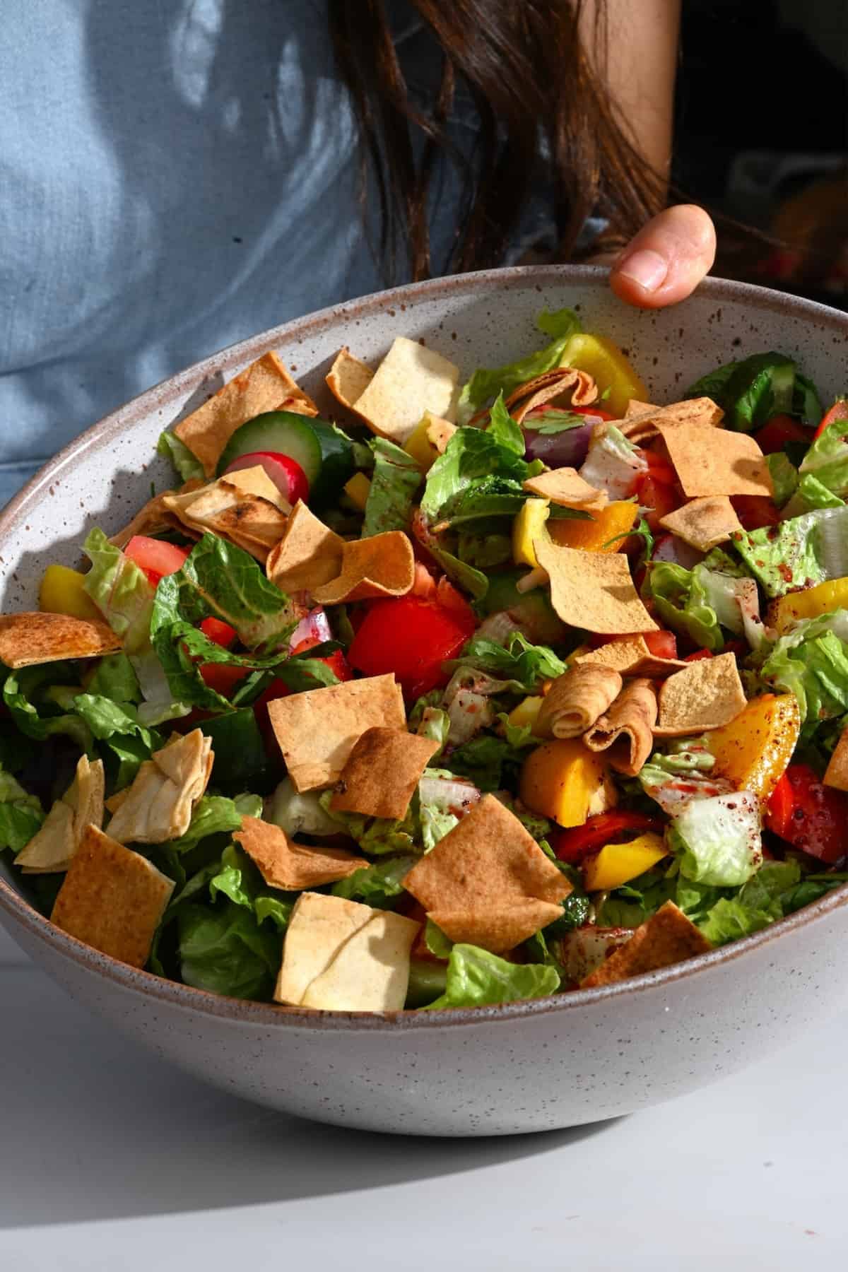 Fattoush salad topped with pita chips