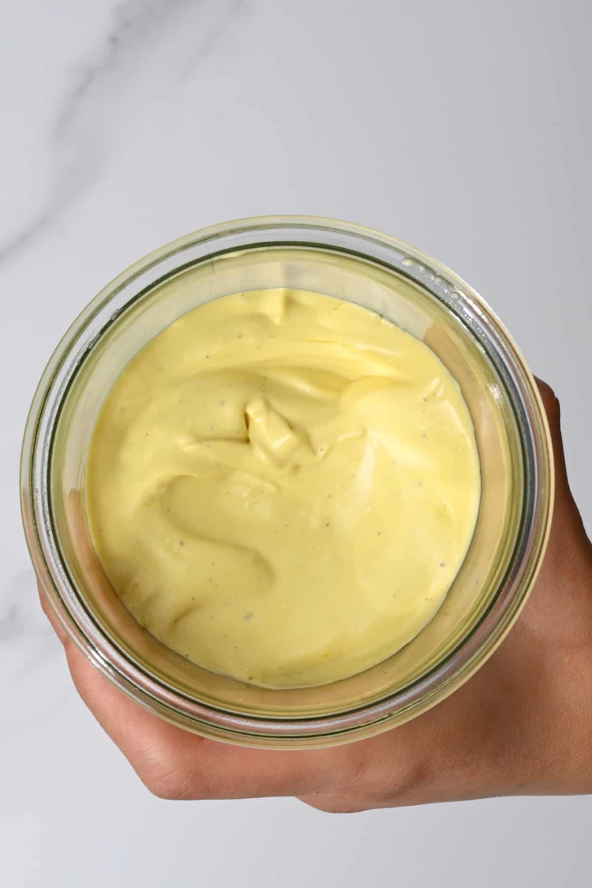 Homemade garlic mayo in a jar