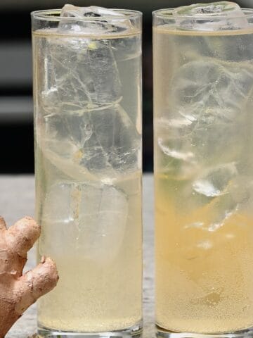 Two glasses with homemade ginger ale and ice