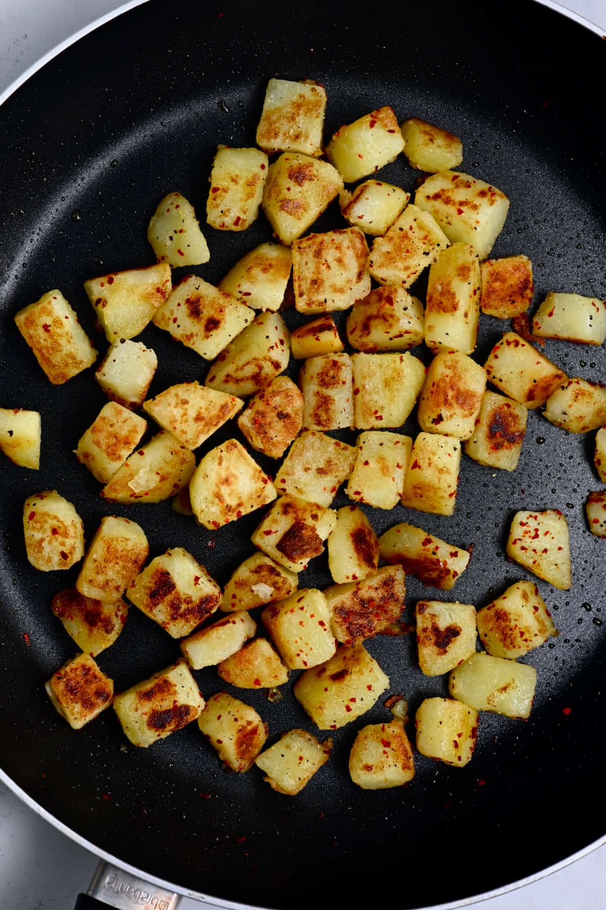 Pan fried potatoes in a skilled