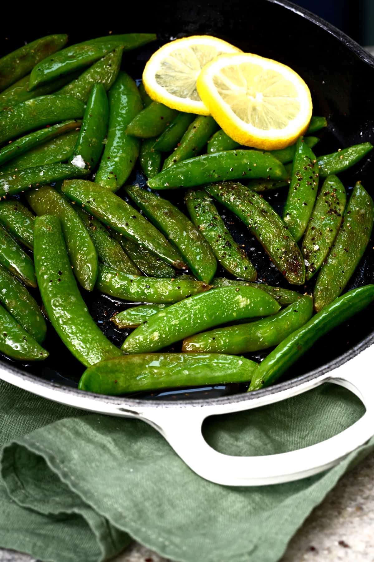 Fresly sauteed sugar snap peas in a pan