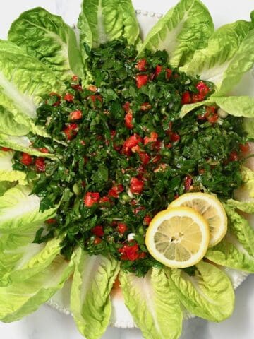 Tabbouleh served with lettuce leaves and lemon slices