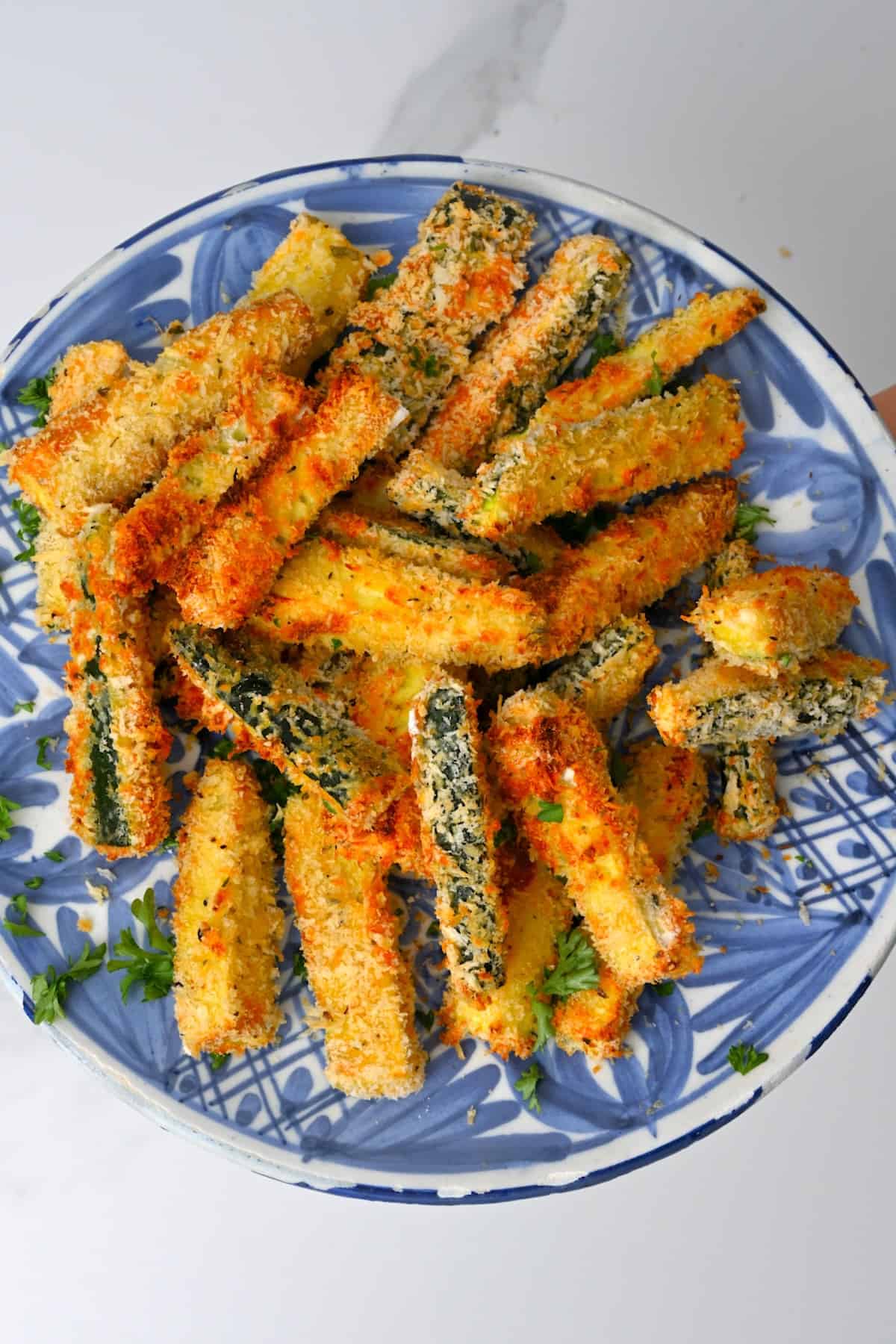 Zucchini fries on a blue plate