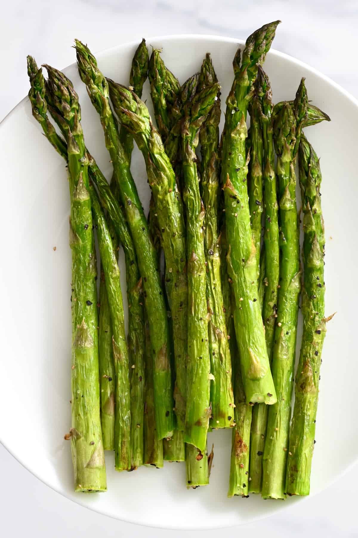 Air fried asparagus on a plate