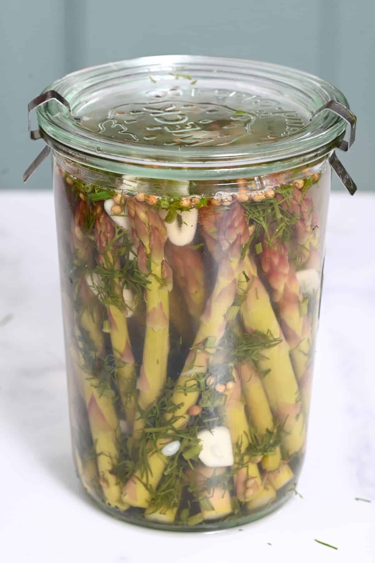 A jar with asparagus pickles