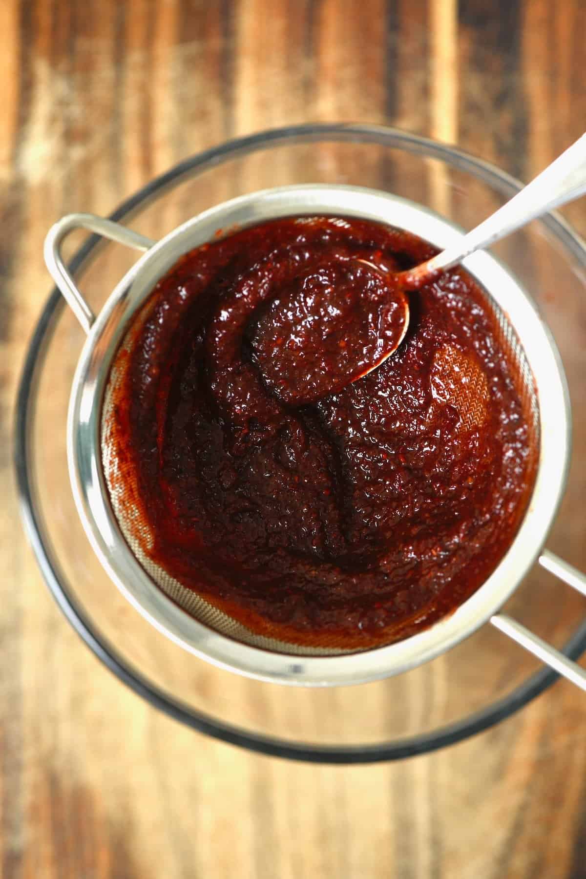 Passing chamoy through a sieve