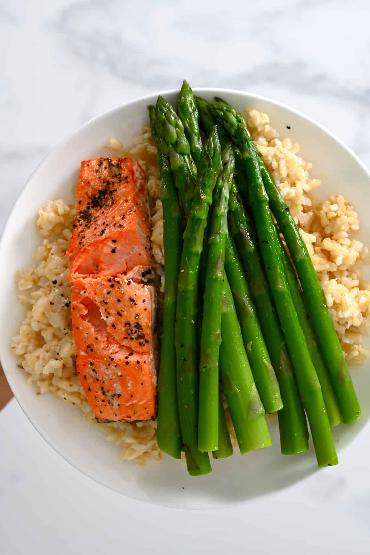 A serving of salmon asparagus and rice