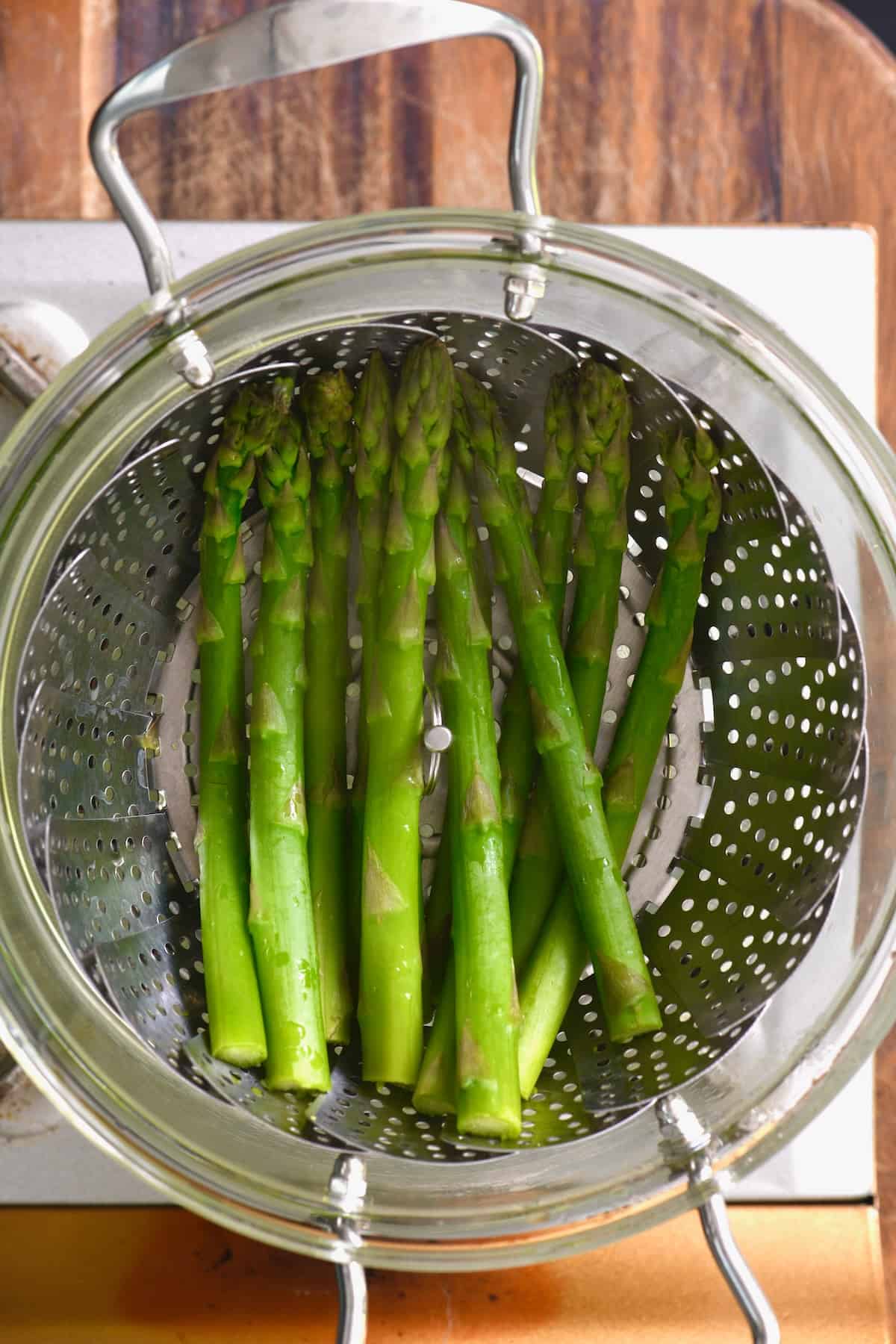 Steaming asparagus in a pot