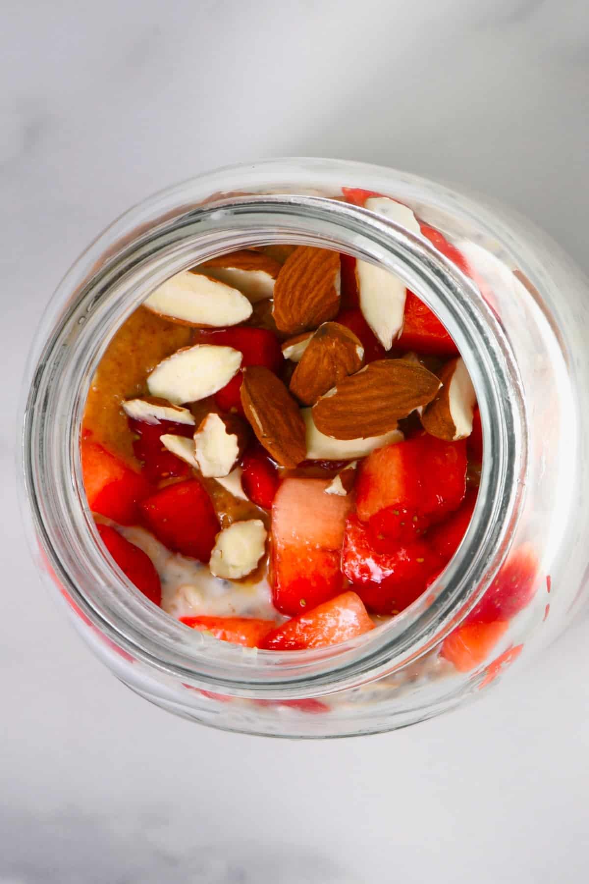 A jar with strawberry shortcake overnight oats