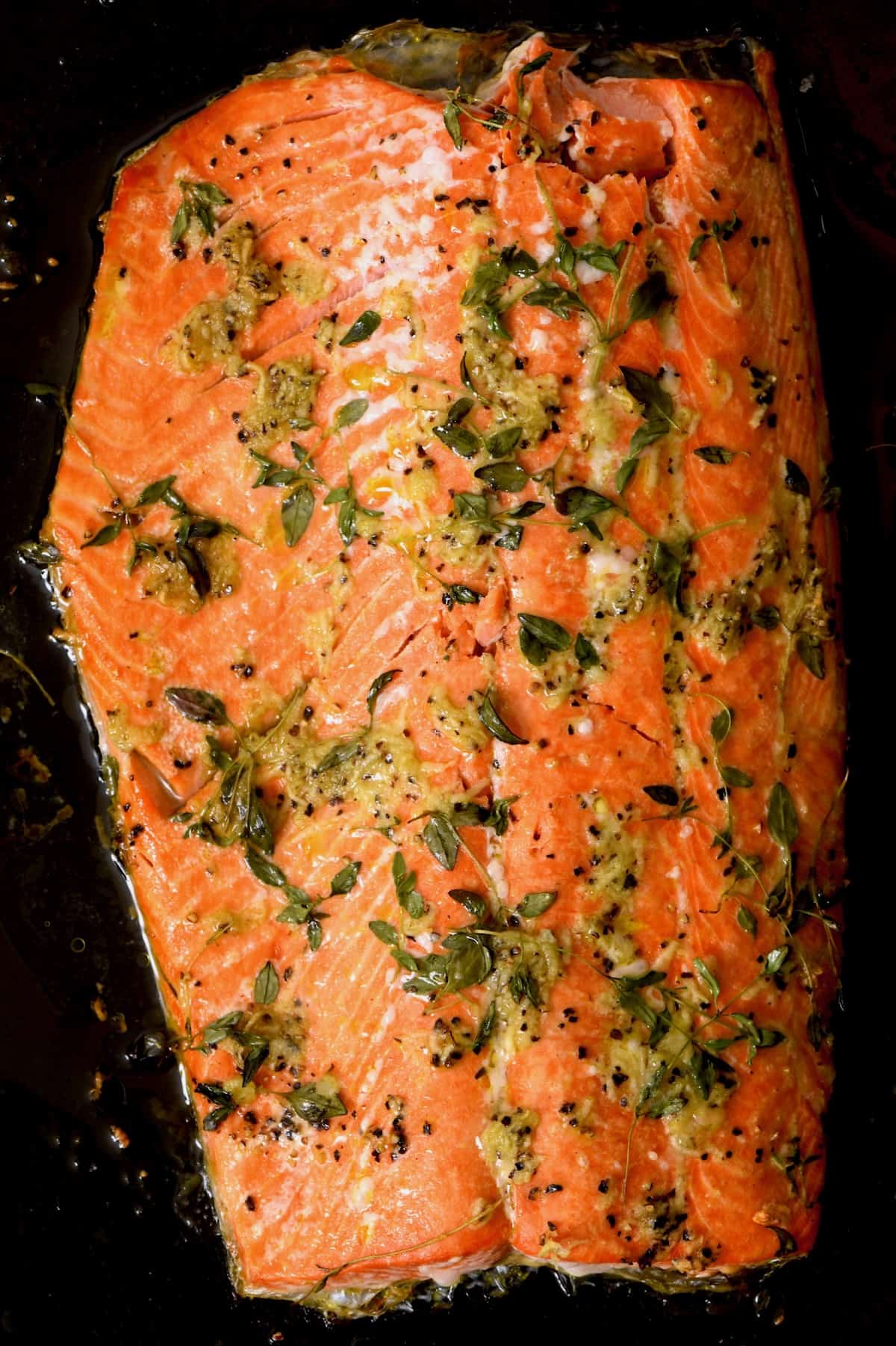 Oven baked salmon filet on a tray