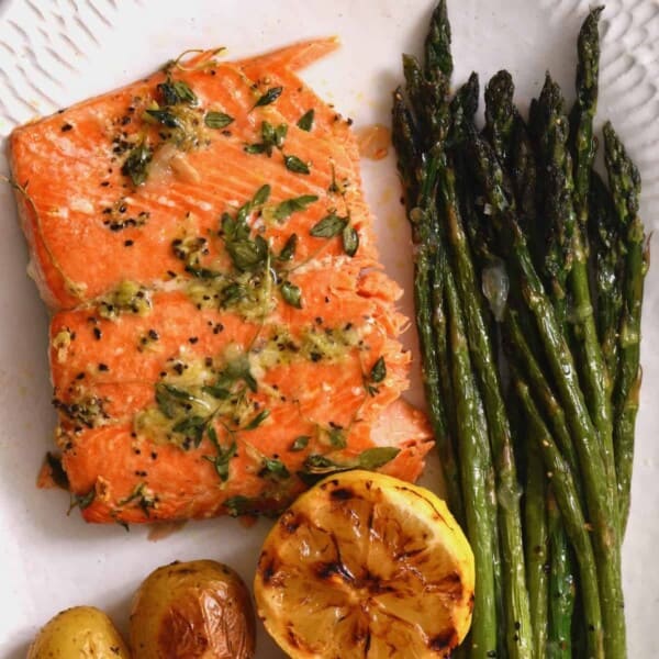Oven baked salmon fillet with asparagus and potatoes