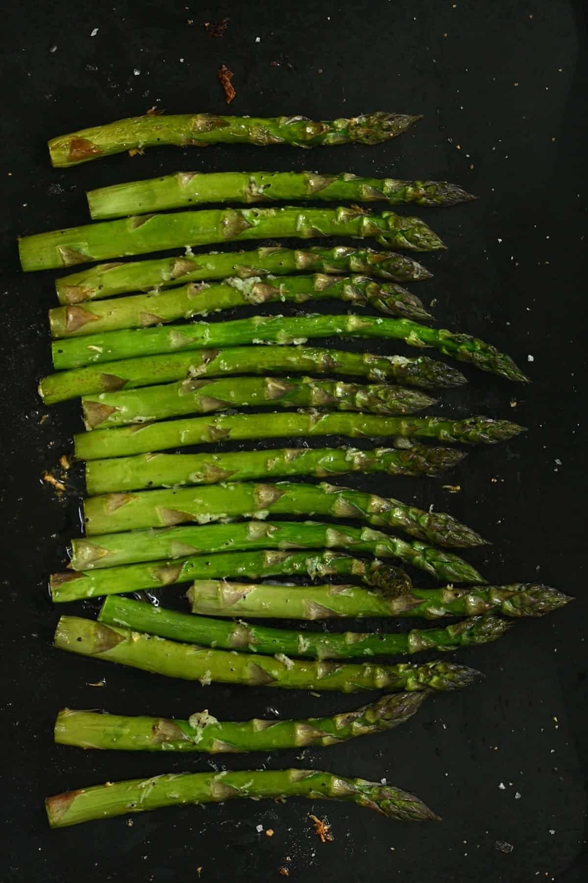 Oven roasted asparagus on a tray