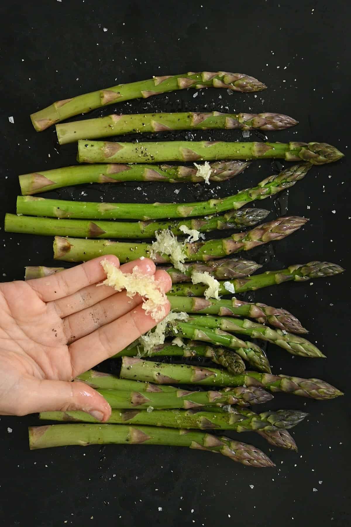 Seasoning asparagus before roasting it