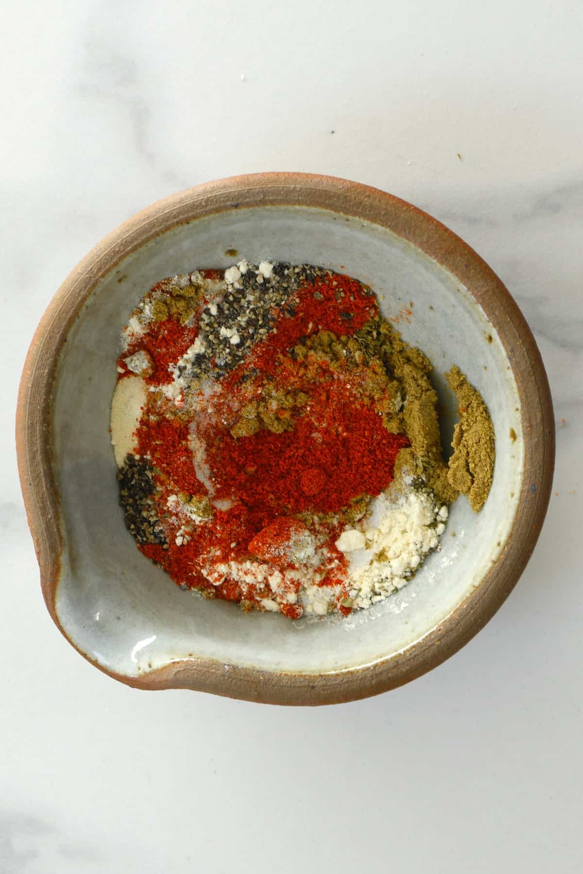 A bowl with taco seasoning spices