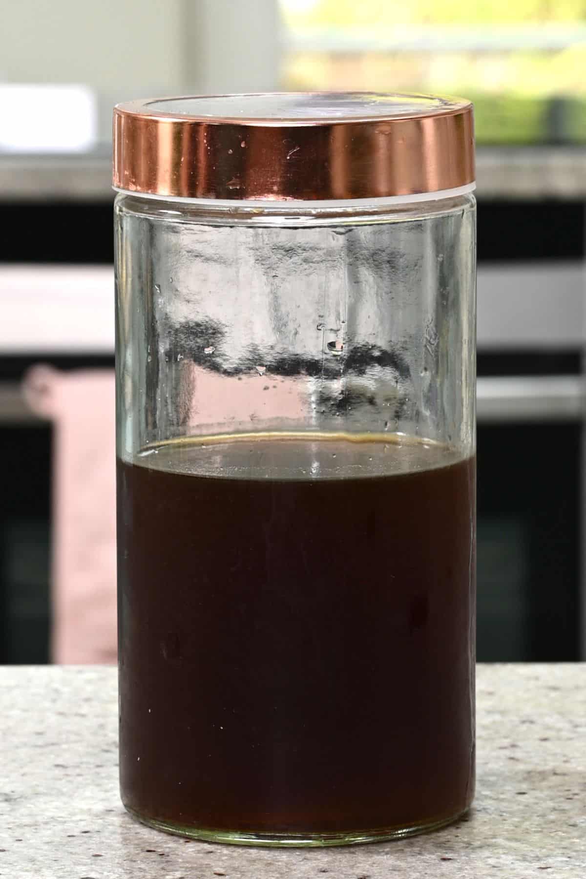 A glass container with cold brew coffee concentrate