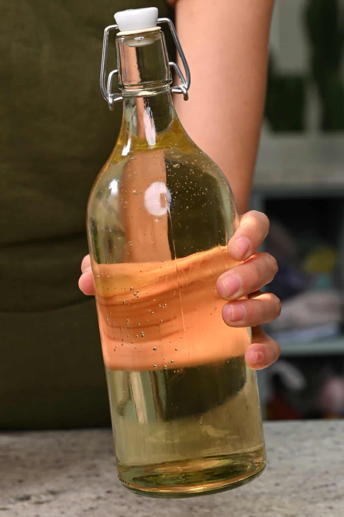 A glass bottle with cold brew tea