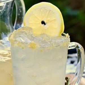 A glass with homemade lemonade and a slice of lemon