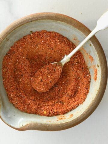 A spoonful of taco seasoning in a bowl