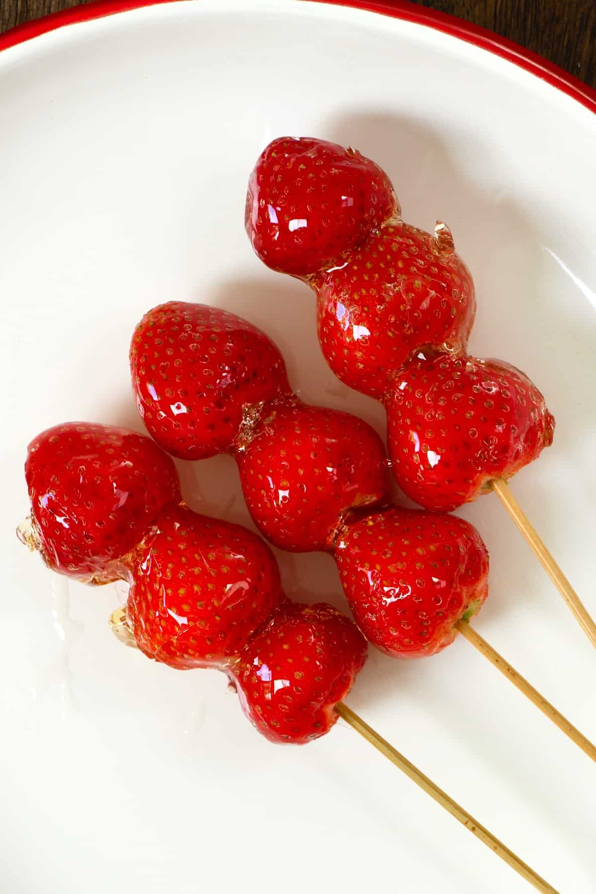 Strawberry tanghulu on a plate
