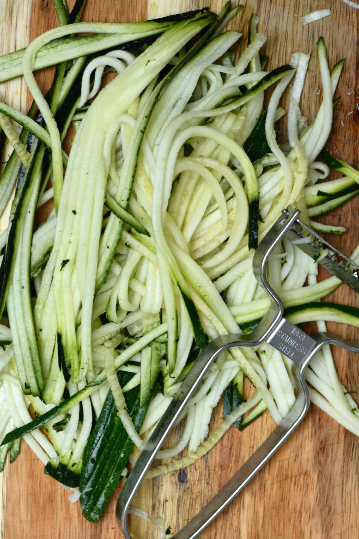 Making zoodles with a julienne peeler