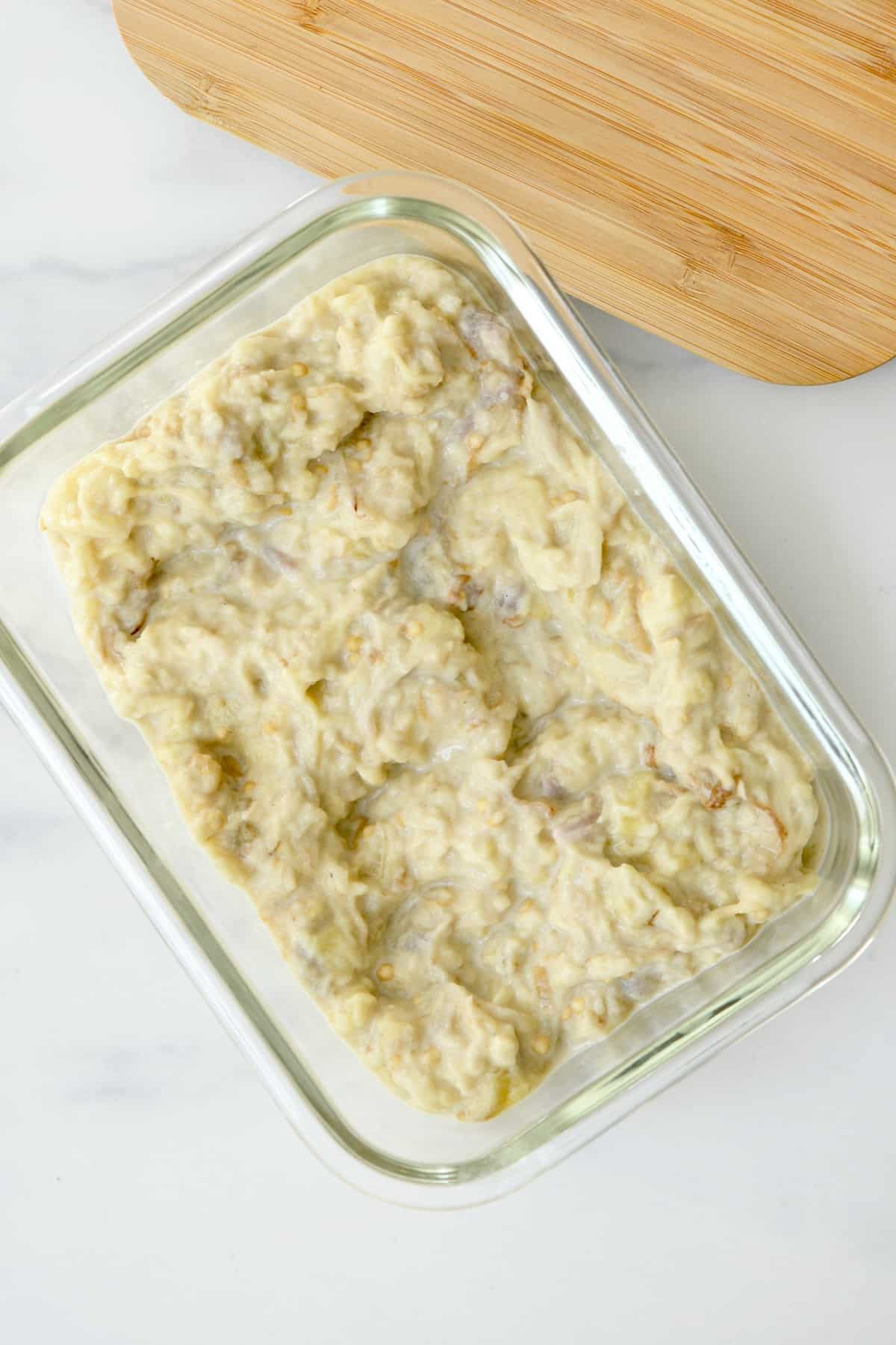 Homemade baba ghanoush in a glass square container