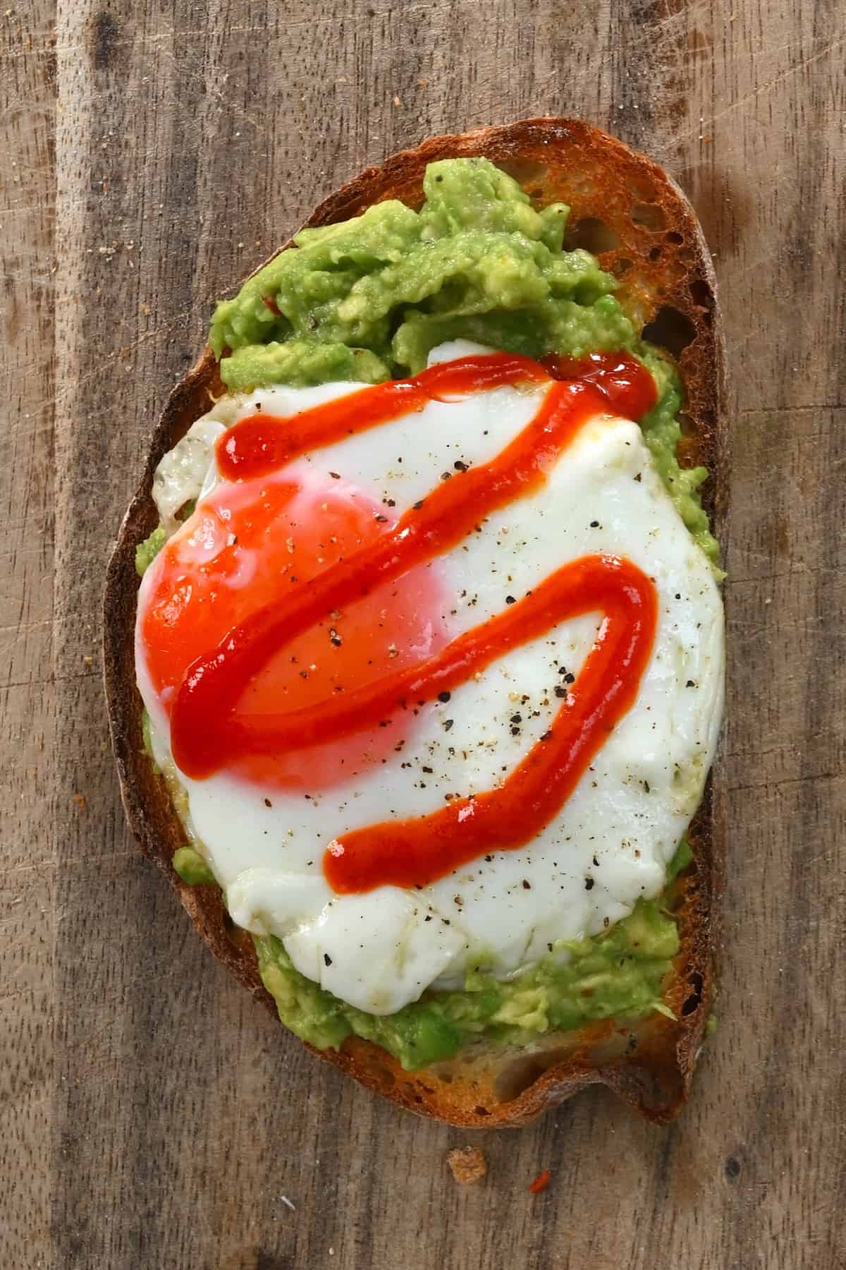 Avocado toast topped with fried egg