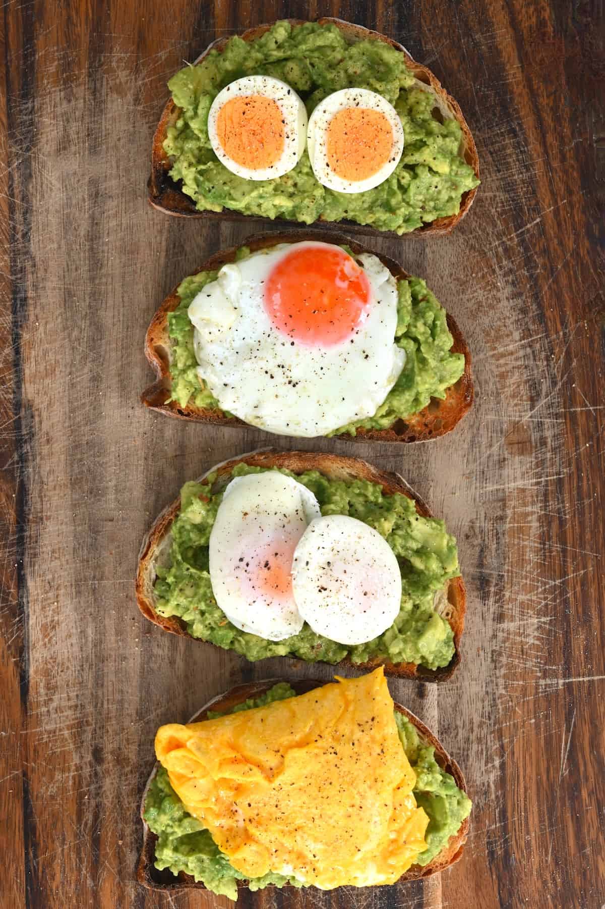 Four avocado toasts with eggs cooked in different ways