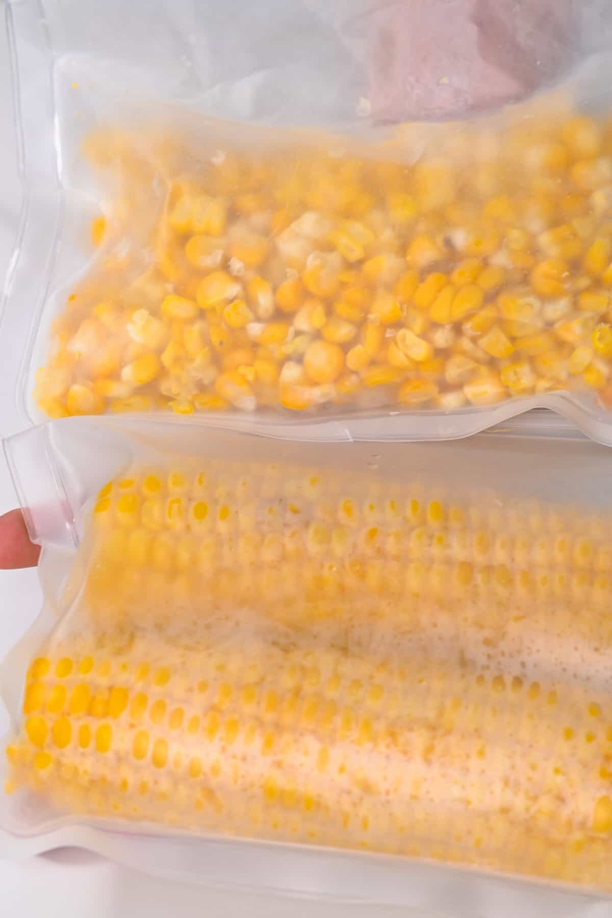 Frozen corn kernels and corn on the cob in freezer bags