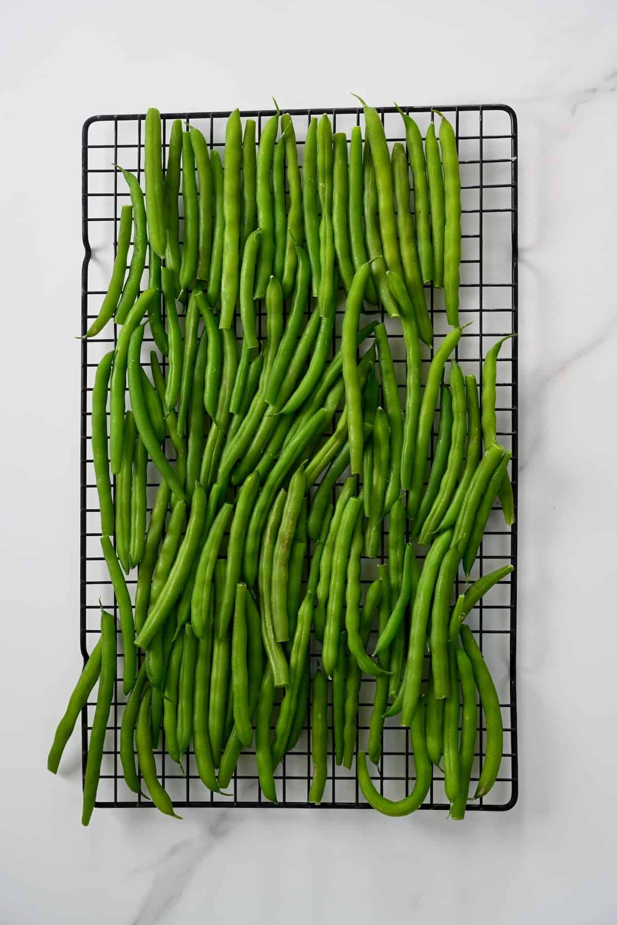 Drying green beans on a rack