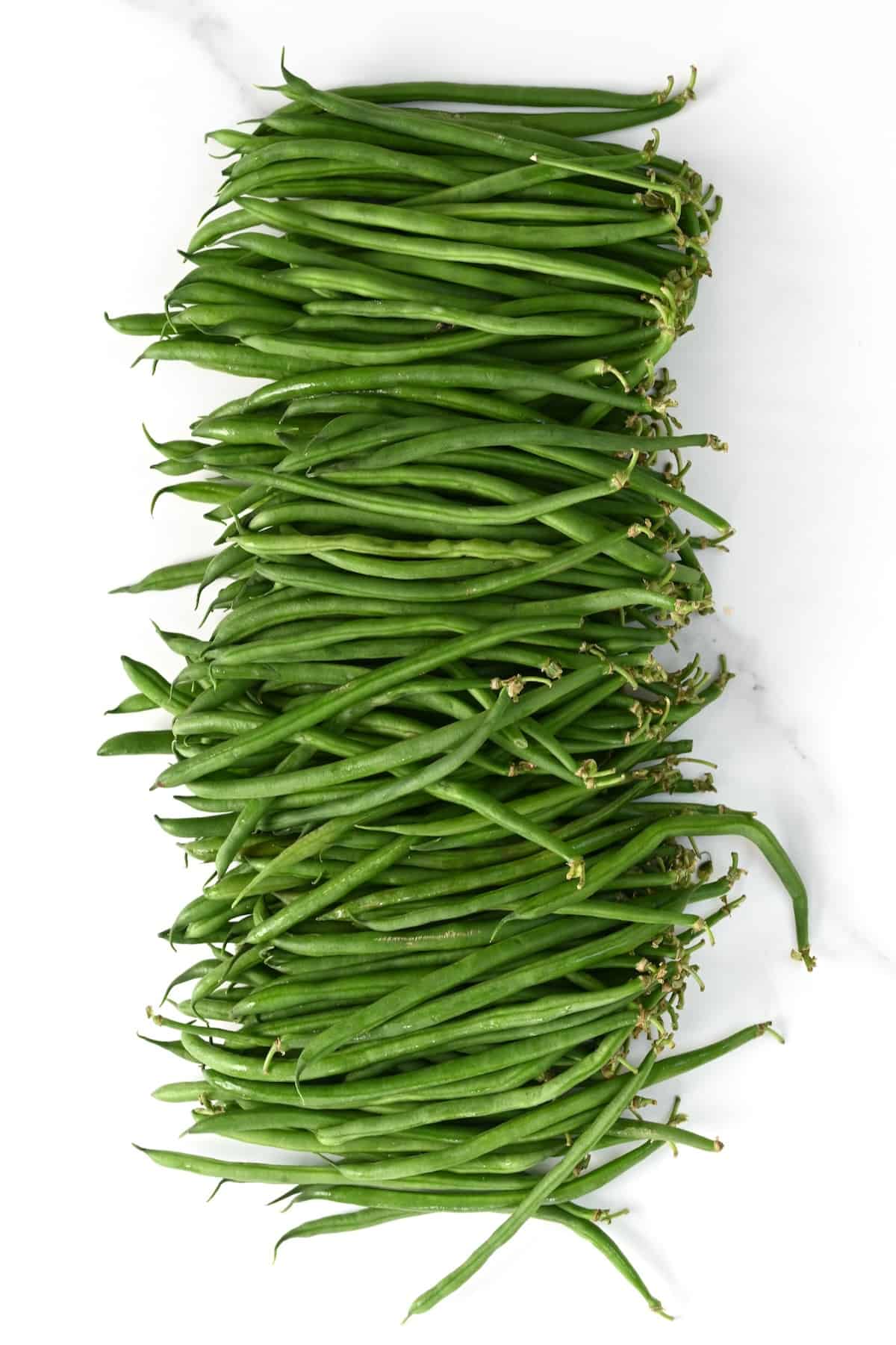 Green beans on a flat surface